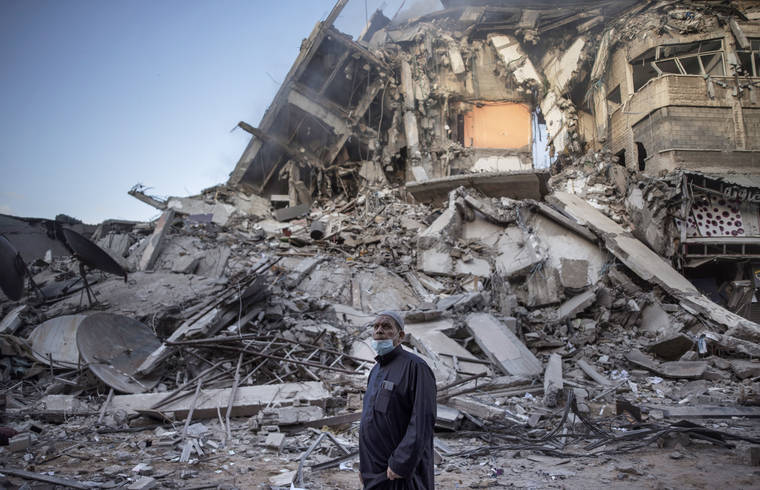 ASSOCIATED PRESS
                                A Palestinian man looked at the destruction of a building hit by Israeli airstrikes in Gaza City, today. Gaza braced for more Israeli airstrikes and communal violence raged across Israel after weeks of protests and violence in Jerusalem.
