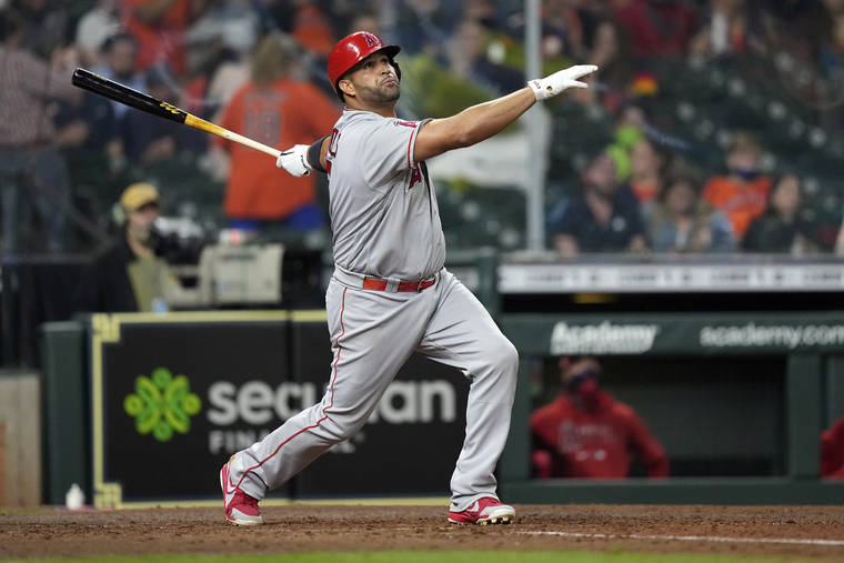 ASSOCIATED PRESS / APRIL 22
                                Los Angeles Angels’ Albert Pujols hits a two-run home run against the Houston Astros during the sixth inning of a baseball game in Houston on April 22.
