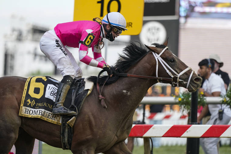 ASSOCIATED PRESS
                                Flavien Prat atop Rombauer reacts as he crosses the finish line to win the Preakness Stakes horse race at Pimlico Race Course today in Baltimore.