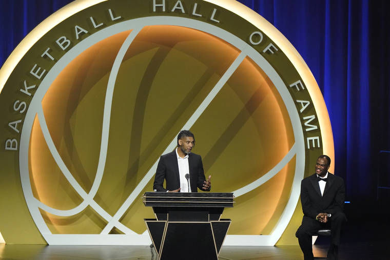 ASSOCIATED PRESS
                                Tim Duncan speaks as presenter David Robinson, right, listens, as Duncan is enshrined with the 2020 Basketball Hall of Fame class on in Uncasville, Conn.