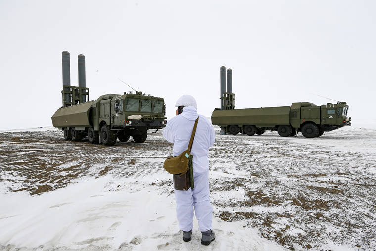 ASSOCIATED PRESS
                                An officer speaks on walkie-talkie as the Bastion anti-ship missile systems take positions on the Alexandra Land island near Nagurskoye, Russia, Monday.