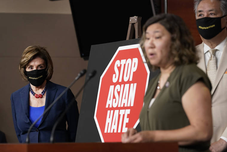 ASSOCIATED PRESS
                                House Speaker Nancy Pelosi of Calif., left, listened as Rep. Grace Meng, D-N.Y., center, spoke during a news conference, today, on Capitol Hill in Washington, on the COVID-19 Hate Crimes Act. Rep. Mark Takano, D-Calif., listened at right.
