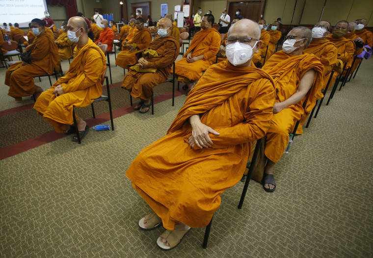 ASSOCIATED PRESS
                                Buddhist monks wait to receive Sinovac COVID-19 vaccines at Priest hospital in Bangkok, Thailand, Tuesday.