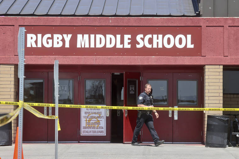 ASSOCIATED PRESS
                                A police officer walks out of Rigby Middle School following a shooting there on May 6 in Rigby, Idaho. Authorities said that two students and a custodian were injured, and a female student has been taken into custody.