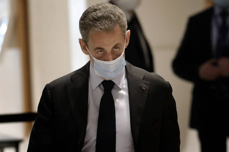 ASSOCIATED PRESS / 2020
                                Former French President Nicolas Sarkozy arrives at the courtroom in Paris.