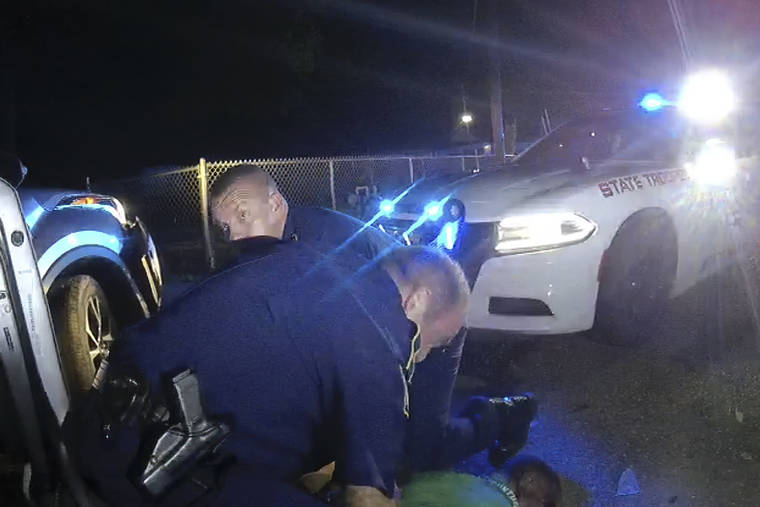 LOUISIANA STATE POLICE VIA ASSOCIATED PRESS
                                his image from video from Louisiana state trooper Lt. John Clary’s body-worn camera shows troopers holding Ronald Greene on his stomach, in May 2019, outside of Monroe, La.