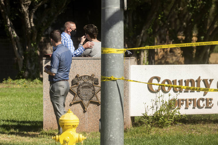 ASSOCIATED PRESS
                                A man comforts a woman near the scene of a shooting at a Santa Clara Valley Transportation Authority facility today in San Jose, Calif. Santa Clara County sheriff’s spokesman said the railyard shooting left nine people, including the shooter, dead.