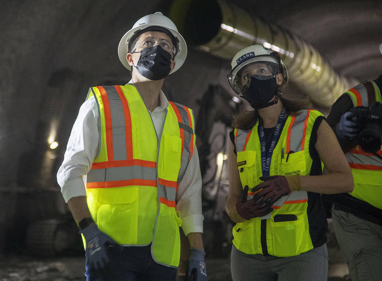 ASSOCIATED PRESS
                                Construction project manager Gabrielle Ferro, second right, speaks with U.S. Secretary of Transportation Pete Buttigieg, during a tour of an underground tunnel for the expansion of the Hartsfield–Jackson Atlanta International Airport plane train tunnel at the Hartsfield–Jackson Atlanta International Airport, on May 21 in Atlanta.
