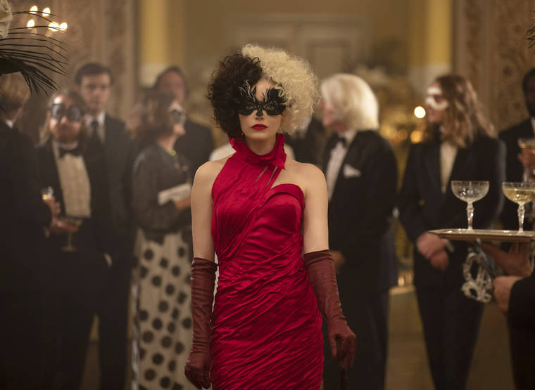 DISNEY VIA AP
                                This image released by Disney shows Emma Stone in a scene from “Cruella.”