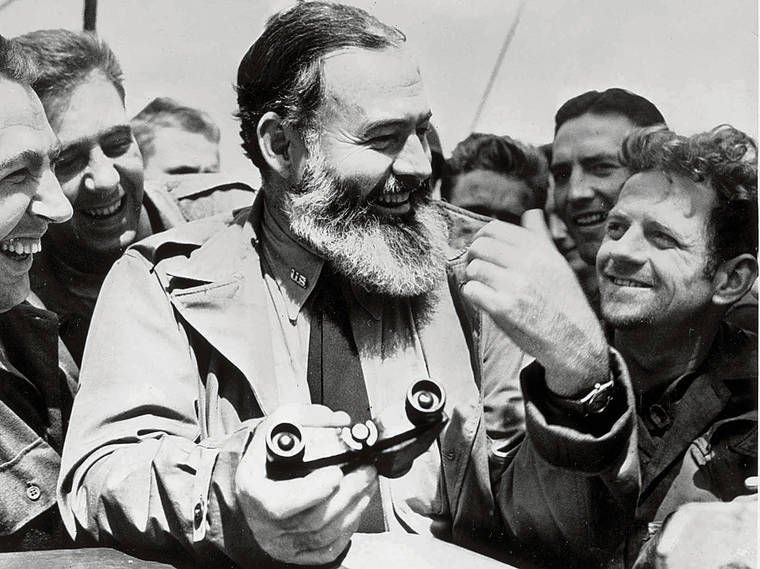 TRIBUNE NEWS SERVICE
                                Ernest Hemingway shown travelling with U.S. soldiers, in his capacity as war correspondent, on their way to Normandy for the D-Day landings in 1944.