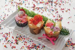 CRAIG T. KOJIMA / CKOJIMA@STARADVERTISER.COM
                                Cristina Nishioka is a professional pastry chef presenting three ways kids can decorate cupcakes to impress their moms for Mother’s Day.