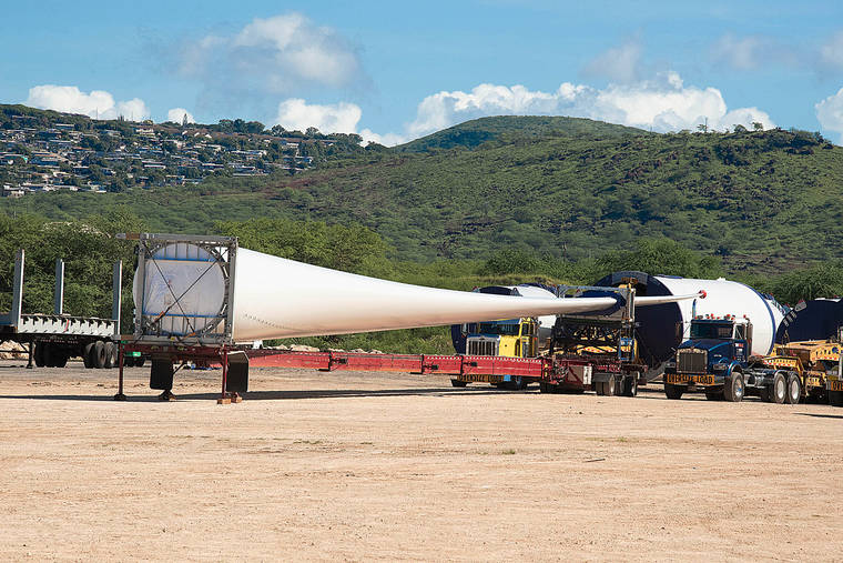 CRAIG T. KOJIMA / 2019
                                Na Pua Makani wind farm remains a target of criticism to various communities. Parts for new turbines wait for transport to the wind farm in Kahuku.