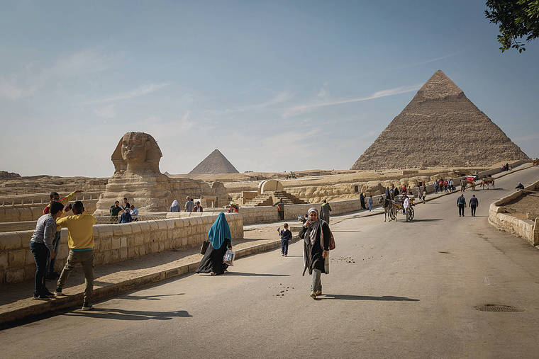 NEW YORK TIMES
                                Tourist sites like the Sphinx and pyramids of Giza are open again in Egypt.