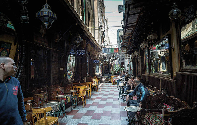 NEW YORK TIMES
                                Sites like the El Fishawy cafe in the centuries-old Khan el Khalili market in Cairo are usually crowded with tourists, but the pandemic has kept the numbers down.