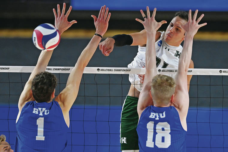 ASSOCIATED PRESS
                                Hawaii’s Guilherme Voss hit the ball against BYU’s Davide Gardini (1) and Miki Jauhiainen (18) during the NCAA men’s volleyball championship match Saturday in Columbus, Ohio.