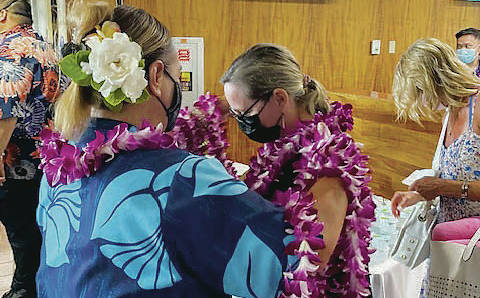 COURTESY HAWAIIAN AIRLINES
                                Hawaiian Airlines passengers in Phoenix received lei Friday upon boarding the first seasonal Phoenix-Maui flight. The service will be offered through Aug. 15 to meet pent-up demand for the Memorial Day holiday and the summer travel season.