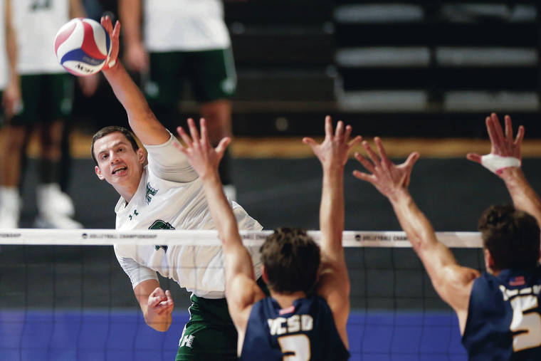 ASSOCIATED PRESS / MAY 6
                                Hawaii’s Rado Parapunov, left, hits the ball over the net against UC Santa Barbara’s Roy McFarland, center, and Keenan Sanders in the semifinals of the NCAA men’s college volleyball tournament Thursday in Columbus, Ohio.