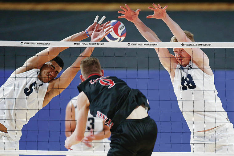 ASSOCIATED PRESS
                                Above, BYU’s Gabi Garcia Fernandez, left, and Miki Jauhiainen tried to block a shot in the victory.