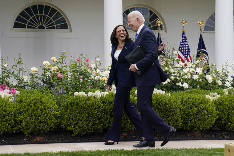 ASSOCIATED PRESS
                                President Joe Biden walks with Vice President Kamala Harris after speaking on updated guidance on face mask mandates and COVID-19 response, in the Rose Garden of the White House, today, in Washington.