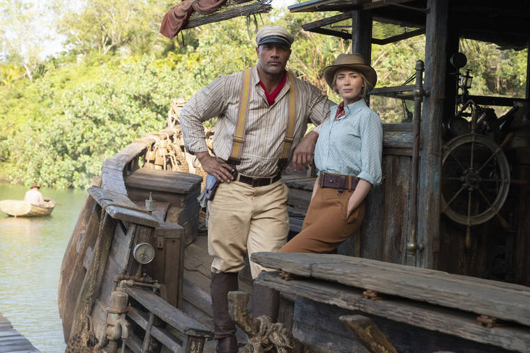 COURTESY DISNEY VIA AP
                                Dwayne Johnson as Frank and Emily Blunt as Lily in ‘Jungle Cruise.’
