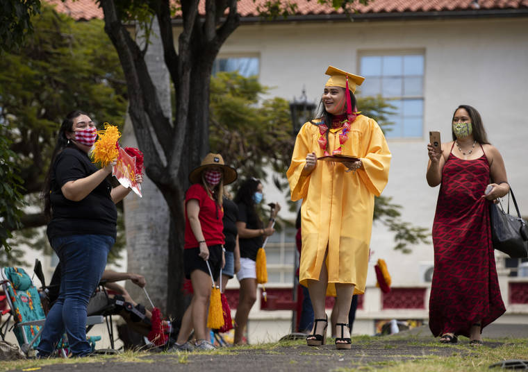CINDY ELLEN RUSSELL / 2020
                                Roosevelt High School class of 2020 graduate Makalei Chan was greeted with cheers after receiving her degree.