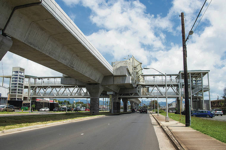 CRAIG T. KOJIMA / APRIL 7
                                The trains for Honolulu’s rail project have wheels that are too narrow for the track, leading to more delays to solve the problem. Above, one of the rail stations is seen on Farring­ton Highway near Mokuoala Street in Waipahu.