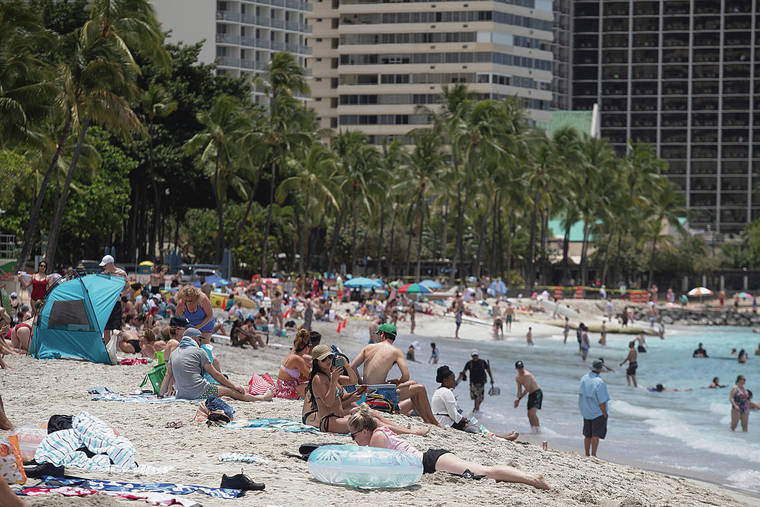 CINDY ELLEN RUSSELL / CRUSSELL@STARADVERTISER.COM
                                A bill that allows counties to raise their own TAT up to 3 percentage points for up to 10 years would increase the cost of a Hawaii vacation. Above, beachgoers packed Waikiki Beach on Friday.
