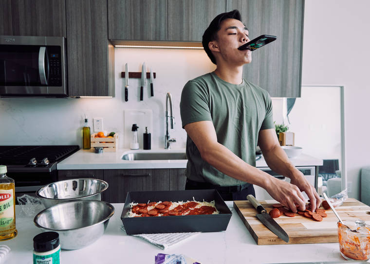 NEW YORK TIMES
                                Newton Nguyen films a cooking video for TikTok at his home in Los Angeles last Monday.