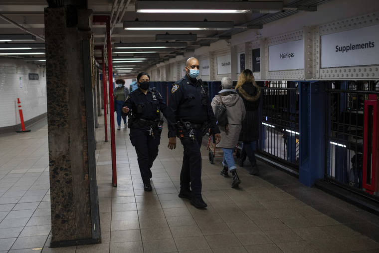 NEW YORK TIMES
                                Police officers patrol the Union Square subway station in Manhattan last Friday.