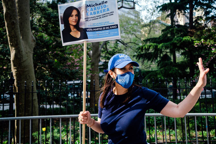 NEW YORK TIMES / APRIL 28
                                Michelle Caruso-Cabrera campaigns for New York City comptroller in Manhattan.