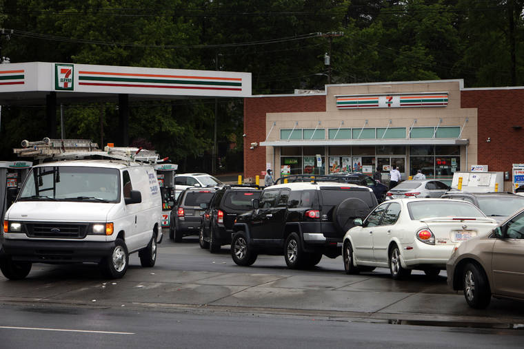 NEW YORK TIMES
                                Cars wait in line at a gas station in Charlotte, N.C., on Wednesday.