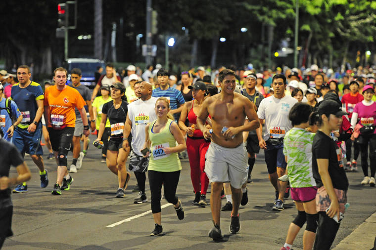 STAR-ADVERTISER / 2019
                                Racers run along Ala Moana Blvd. at the start of Waikiki in the 47th anniversary of the 26.2 mile Honolulu Marathon.