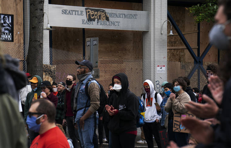 NEW YORK TIMES / 2020
                                Demonstrators protesting the death of George Floyd maintain their presence outside a police precinct in the Capitol Hill neighborhood of Seattle.