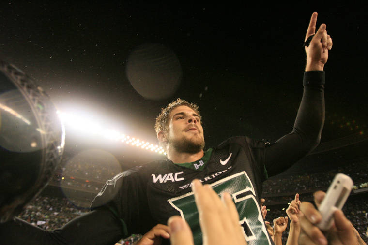 2007 November 23 SPT - Hawaii’s Colt Brennan raises a finger in victory after an NCAA Football game between defending WAC Champions Boise State and Hawaii, Friday, Nov. 23, 2007, at Aloha Stadium in Honolulu. Hawaii held on to win 39-27, capturing the 2007 WAC title and handing Boise State their only loss of the season. Honolulu Star-Bulletin photo by Jamm Aquino.