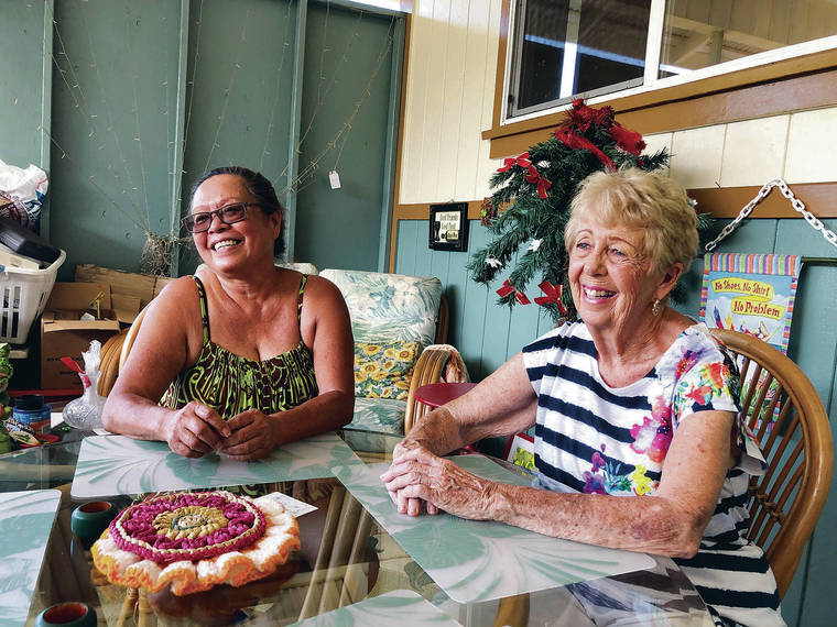 CHRISTIE WILSON / CWILSON@STARADVERTISER.COM
                                Libbie Kaahu-Evans, left, and Dolores Nakamoto, once neighbors in Leilani Estates before abandoning their homes to the May 2018 eruption, now share a rental in Hawaiian Paradise Park, where they chatted in the carport Thursday.