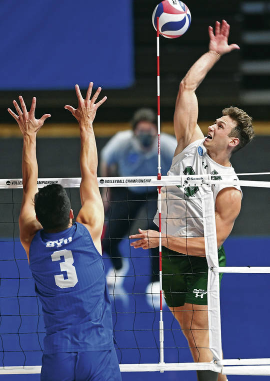 ASSOCIATED PRESS
                                Hawaii’s Colton Cowell soared for a shot as Brigham Young’s Wil Stanley tried for a block during Saturday’s NCAA men’s volleyball championship in the Covelli Center in Columbus, Ohio.