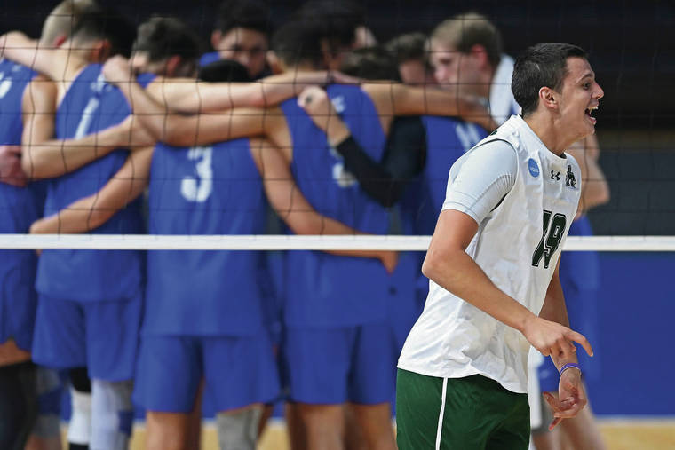 ASSOCIATED PRESS
                                Hawaii’s Rado Parapunov, the Most Valuable Player of the tournament, started to join his teammates in an oncourt celebration while the losing BYU team huddled after Saturday’s NCAA men’s volleyball championship at the Covelli Cener in Columbus, Ohio.