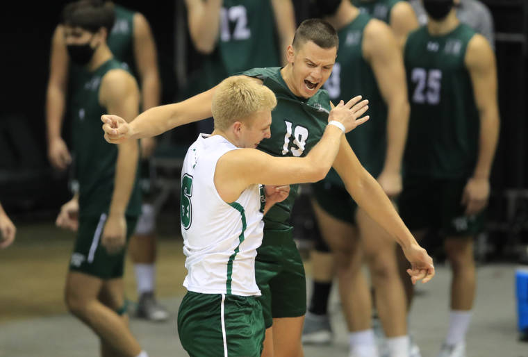 Jamm Aquino/jaquino@staradvertiser.com
                                Hawaii opposite Rado Parapunov (19), right, and libero Gage Worsley (6) chest bumped while taking to the court on Saturday, April 17, at Stan Sheriff Center. Both were named first-team All-Americans today, along with middle blocker Patrick Gasman.