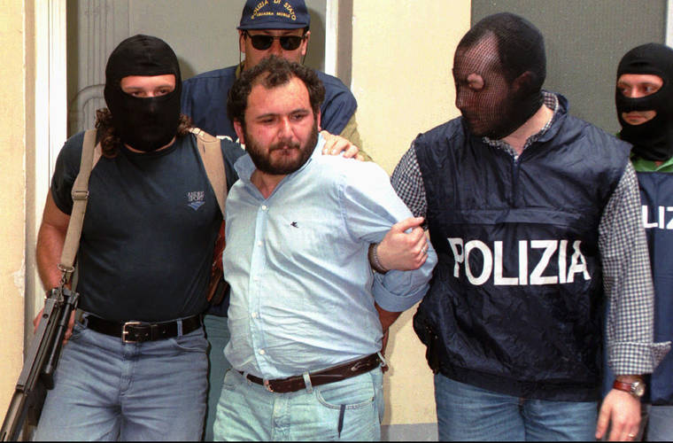 ASSOCIATED PRESS
                                Giovanni Brusca was escorted by masked policemen, in May 1996, outside Police H.Q. in Palermo, Sicily. Giovanni Brusca, 64, was released from prison this week after serving 25 years of a life term for some of Cosa Nostra’s most heinous crimes.