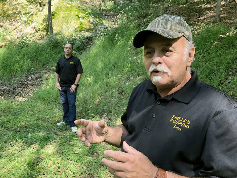 ASSOCIATED PRESS
                                Dennis Parada, right, and his son Kem Parada stand at the site of the FBI’s dig for Civil War-era gold in Dents Run, Pa., in 2018. Court documents unsealed today show that an FBI agent applied for a federal warrant in 2018 to seize a cache of gold that he said had been “stolen during the Civil War” while en route to the U.S. Mint in Philadelphia. The Paradas, co-owners of the treasure-hunting outfit Finders Keepers, have said they believe the FBI found gold at the site and have pursued legal action to get more information.