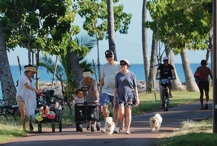 JAMM AQUINO / JAQUINO@STARADVERTISER.COM
                                Parkgoers took in the afternoon sun and sea air without masks at Ala Moana Regional Park on Wednesday, a week after the state relaxed mask mandates outdoors.