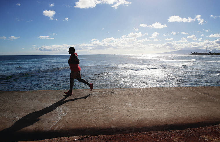 JAMM AQUINO / JAQUINO@STARADVERTISER.COM
                                According to a new statewide poll, Hawaii residents think the coronavirus pandemic is improving. A jogger ran the point at Magic Island inside Ala Moana Regional Park on Wednesday.
