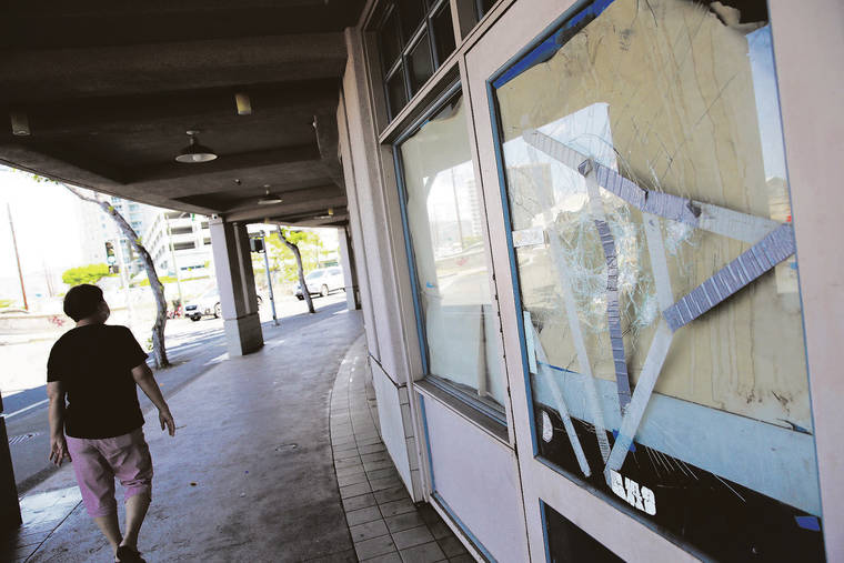 JAMM AQUINO / JAQUINO@STARADVERTISER.COM
                                Chinatown has been designated as a Weed and Seed community in an attempt to reduce crime in the area. Community member Chu Lan Shubert-­Kwock walked past a shattered window of a shuttered business along River Street last month.