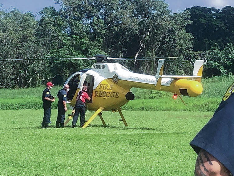 CRAIG T. KOJIMA / 2019
                                A Honolulu Fire Department rescue helicopter is dispatched to Maunawili Park.