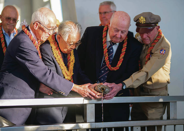 U.S. NAVY / 2016
                                Shiro Wakita, left, a WWII Imperial Japanese Navy pilot; Dr. Hiroya Sugano, director general of the Zero Fighter Admirers Club; Jack DeTour, a former colonel and WWII Army Air Force B-25 pilot; and Jerry Yellin, a former captain and WWII Army Air Force P-51 pilot, pour whiskey at the sixth annual “Blackened Canteen” ceremony at the USS Arizona Memorial during the 75th anniversary of the attack on Pearl Harbor. DeTour died earlier this month at age 97.