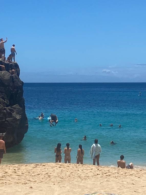 COURTESY HONOLULU EMS
                                Honolulu Ocean Safety today treated a man visiting from California who injured his back upon jumping from Waimea Bay rock. Officials say the rock is about 25 feet high, and that jumping from it is potentially very dangerous.