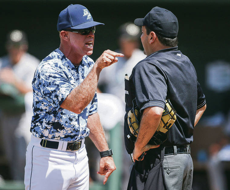 ASSOCIATED PRESS
                                San Diego head coach Rich Hill, left, argued with head umpire Olindo Mattia over an out at third base in an NCAA regional game against Cal Poly on June 2, 2013, in Los Angeles.