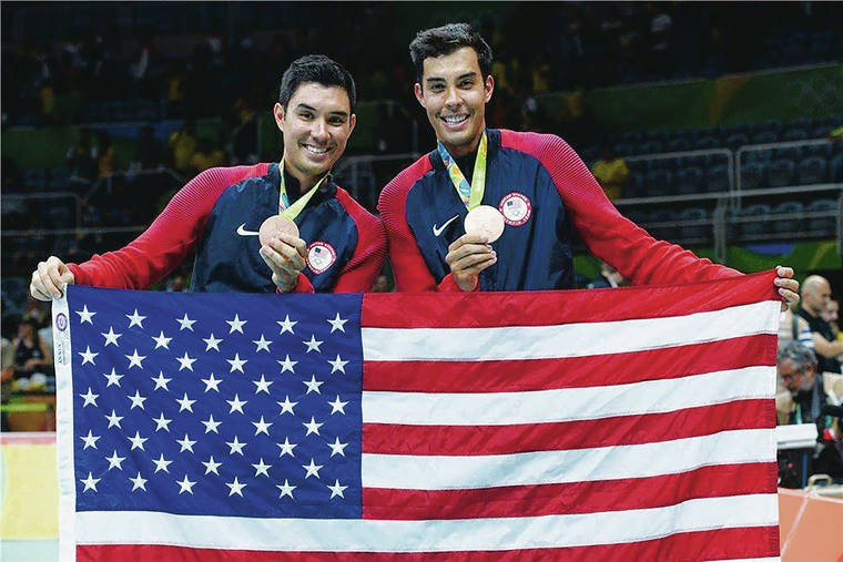 COURTESY KAWIKA SHOJI
                                Brothers Erik and Kawika Shoji displayed their bronze medals while holding the American flag during the 2016 Olympics in Rio de Janeiro