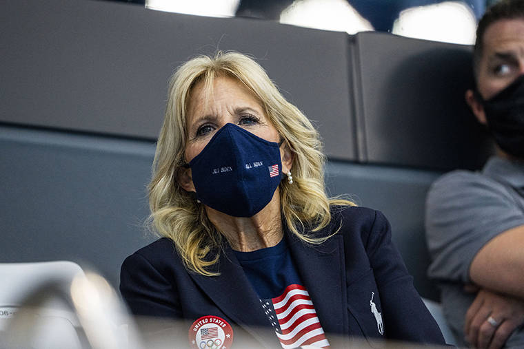 DOUG MILLS/THE NEW YORK TIMES
                                First Lady Jill Biden, wearing a protective face mask, during a swimming event today at the 2020 Summer Olympics in Tokyo. She is scheduled to arrive late this morning at Joint Base Pearl Harbor-Hickam.
