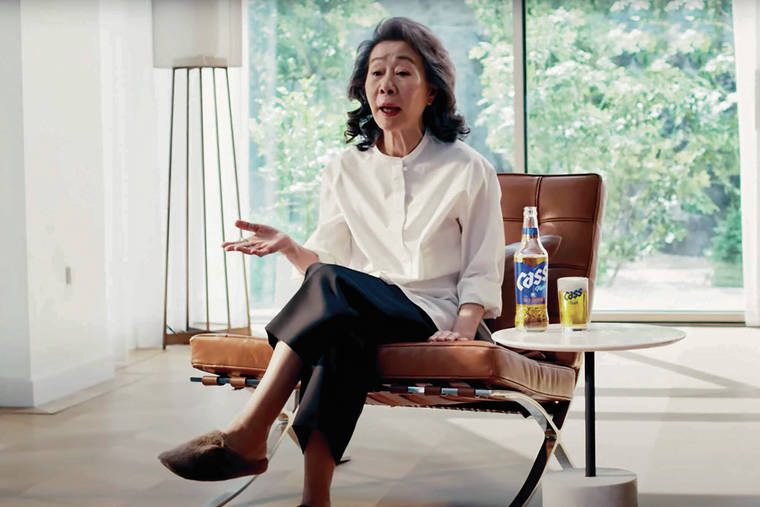 ASSOCIATED PRESS PHOOS
                                South Korean actor Youn Yuh-jung, 74, an Oscar winner for “Minari,” above, appears in Oriental Brewery’s latest ad.